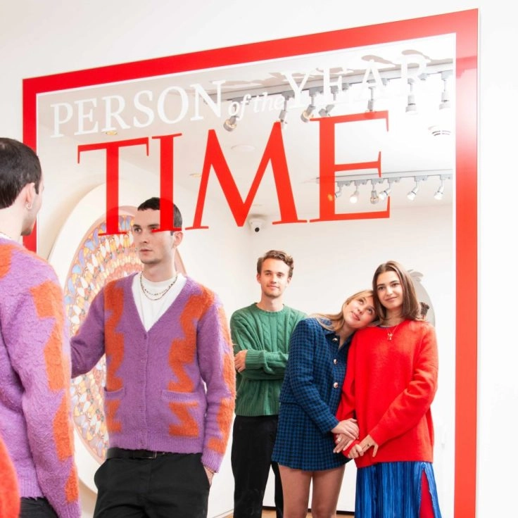 TIME magazine mirror artwork by Mungo Thomson with visitors posing at Moco Museum Amsterdam.